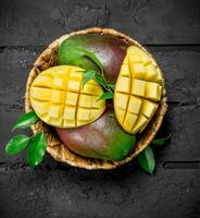 Aromatic fresh mango in a basket. photo