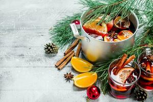 Christmas hot Mulled wine in a pot of spices and herbs. photo