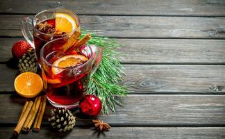 Christmas hot mulled wine with spices and aromatic herbs. photo