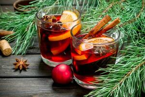 Christmas hot mulled wine with spices and aromatic herbs. photo