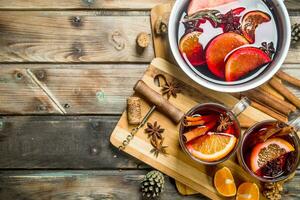 Mulled wine in a pot of spices. photo