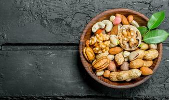 Different types of nuts in bowl. photo