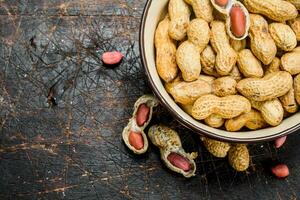 Peanuts in the bowl . photo