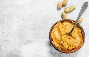 Peanut butter in the bowl . photo