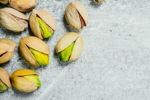 Pistachios on rustic background. photo