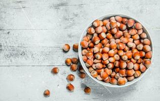 Hazelnuts in the bowl . photo