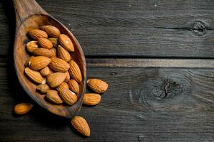 The almonds in the spoon . photo