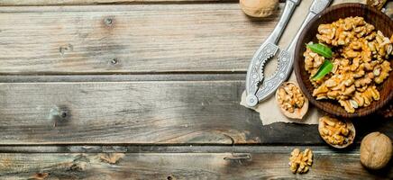 Shelled walnuts with a Nutcracker. photo