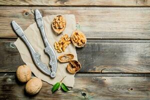 Shelled walnuts with a Nutcracker. photo