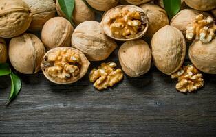 Peeled walnut with leaves . photo