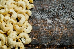 Cashew. On a wooden background photo