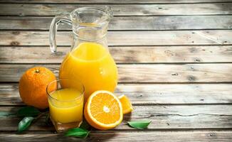 Orange juice in the pitcher. photo