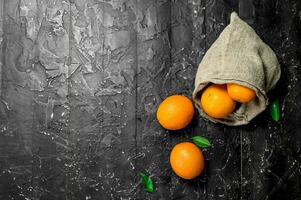 Fresh oranges in the sack. photo