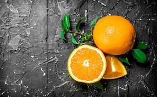 Fresh ripe oranges with leaves. photo