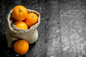 Fresh oranges in the sack. photo