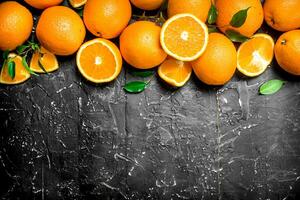 Fresh ripe oranges with leaves. photo