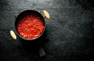 Bolognese sauce in pot. photo