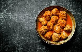 Meat balls in pan. photo