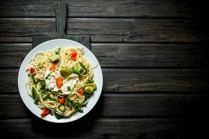 Pasta with Brussels sprouts,broccoli and tomatoes. photo