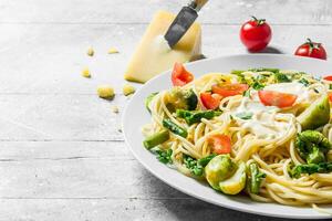 Vegetable paste with broccoli,tomatoes, green beans and Parmesan. photo