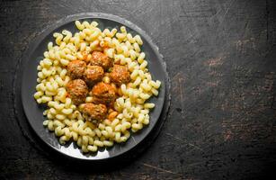 Pasta with meat balls on a plate. photo