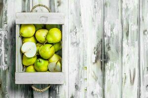 Ripe pears in the box. photo