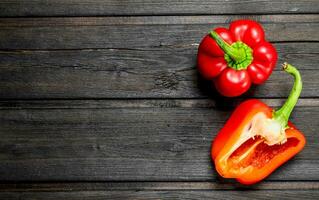 Half and a whole ripe sweet pepper. photo