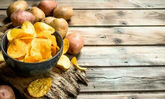 Potato chips in the bowl. photo