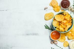 Potato chips with sauces. photo