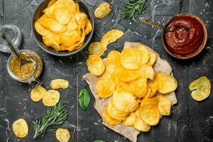 Potato chips with tomato sauce. photo