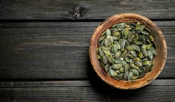 Pumpkin seeds in bowl. photo