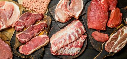 Raw meat. Different kinds of pork and beef meat. photo