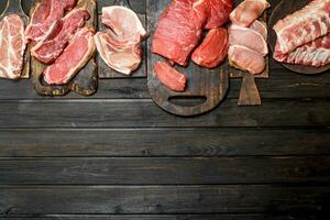 Raw meat. Different kinds of pork and beef meat. photo