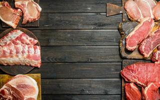 Raw meat. Different kinds of pork and beef meat. photo