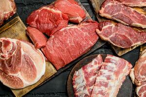 Raw meat. Different kinds of pork and beef meat. photo