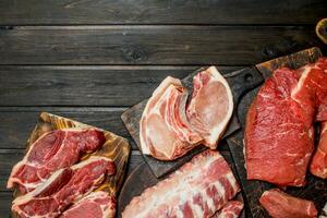 Raw meat. Different kinds of pork and beef meat. photo