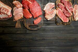 Raw meat. Different kinds of pork and beef meat. photo