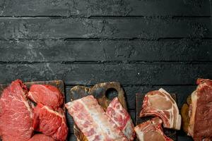 Raw meat. Different kinds of pork and beef meat. photo
