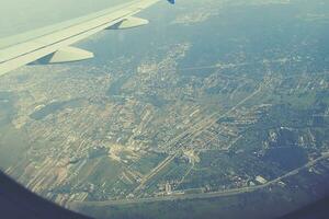 original view of the city of Warsaw in Poland from a flying plane photo