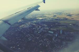 original view of the city of Warsaw in Poland from a flying plane photo