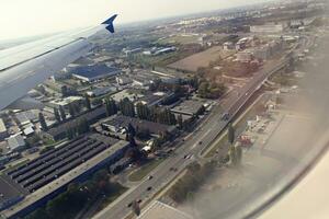 original view of the city of Warsaw in Poland from a flying plane photo