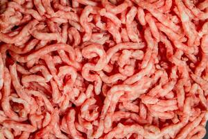 Texture of raw minced meat . photo