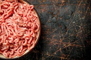 Raw minced beef in bowl . photo