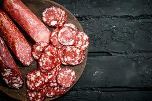 Different types of salami on the Board. photo