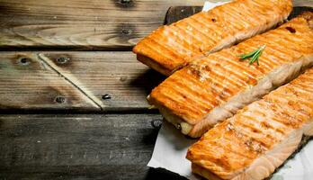 Grilled salmon fillet on a cutting Board. photo