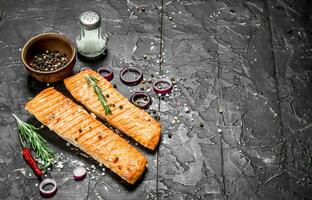 Grilled salmon fillet with spices and herbs. photo