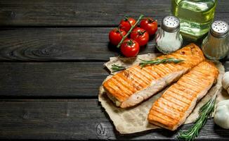 Grilled salmon fillet with garlic, herbs and spices. photo