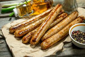 Grill sausages with herbs and spices. photo