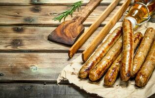 Grill sausages with herbs and spices. photo