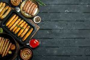 Assortment of different types of fried sausages. photo